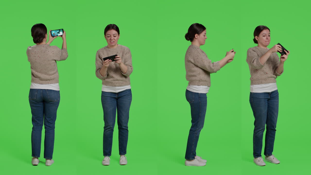 Woman Playing Game on Mobile Phone in Chroma Key Studio