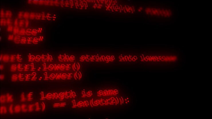 Donkerrode softwarecode visual met vervaagde programmeertekst, gloeiende numerieke matrix en zwarte cyberachtergrond