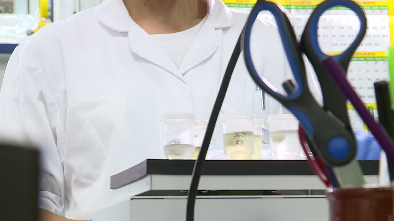 Scientist conducting an experiment in a laboratory.