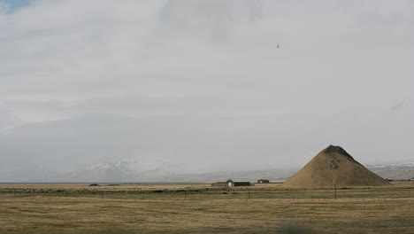 icelandic landscape with farmland and mountains