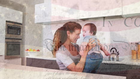 animación de la bandera de ee.uu. y escritos sobre madre caucásica feliz jugando con el bebé en la cocina
