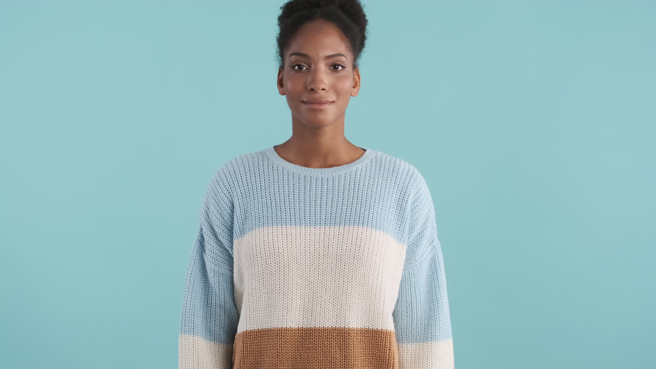 Happy african american woman in cozy sweater