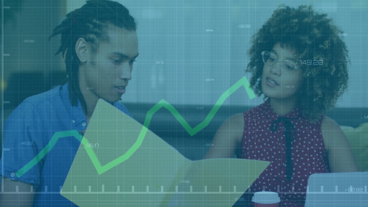 Discussing financial data, two people with graph animation overlay in office setting
