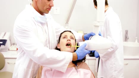 Dentist-taking-x-ray-of-patients-teeth