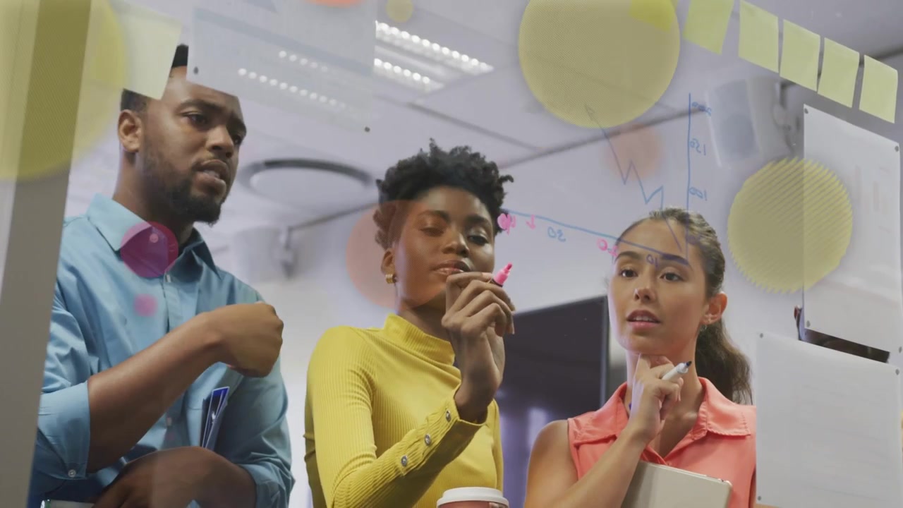 Woman in yellow writing on glass, team planning business with color circles partially obscuring