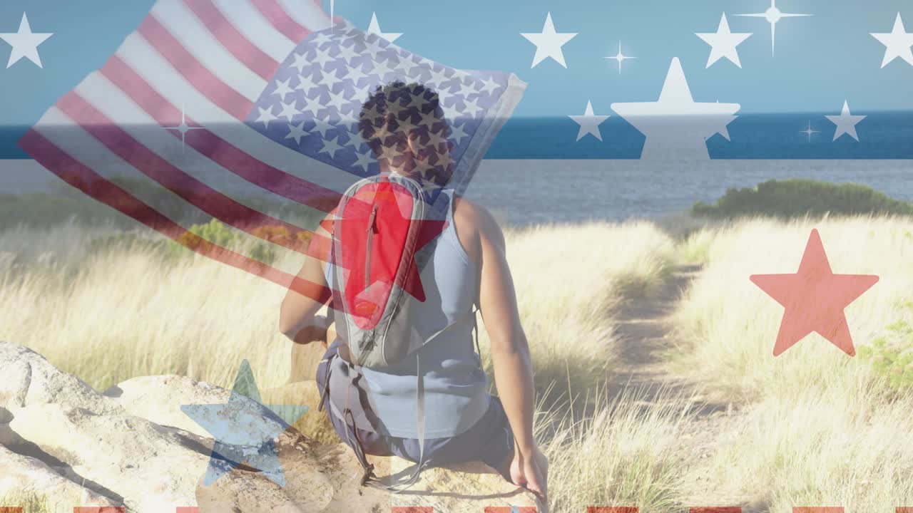 산에 앉아 있는 아프리카계 미국인 남성 위에 있는 미국 국기의 애니메이션