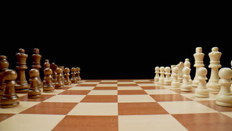 chess board pieces, macro pull back across board, slow motion