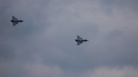 two eurofighters fly one behind the other in slow motion. taken at the air show called airpower 2024
