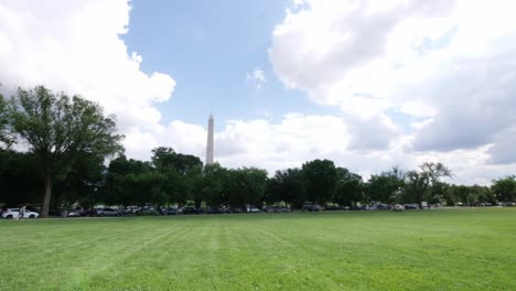 wide of the washington monument through some trees located in washington dc in the usa