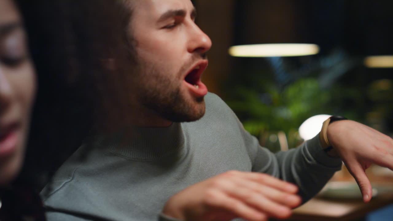 Drinking man having fun on fancy restaurant friends meeting. Dance moves concept
