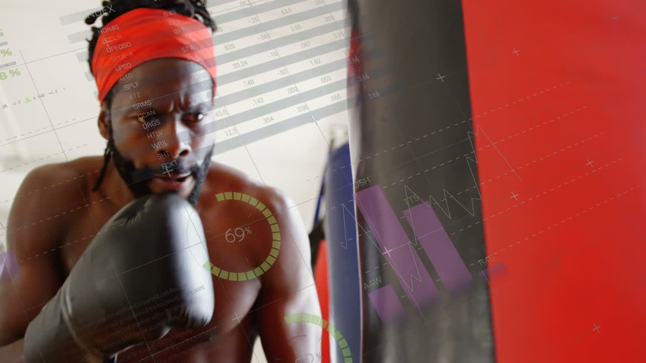 Boxer raising gloves and striking heavy bag in fitness, animated charts tracking power and stamina