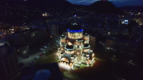 wide shot of the illuminated orthodox cathedral in the centrum of deva, romania