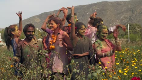 multi ethnic people celebrating the festival of colors holi in india