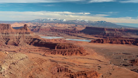 timelapse, clouds above valley and red rock formations in moab area, utah usa