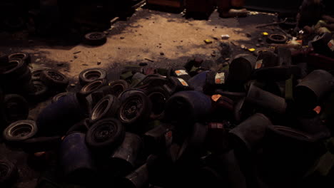 broken toys scattered across a dimly lit room in an abandoned location