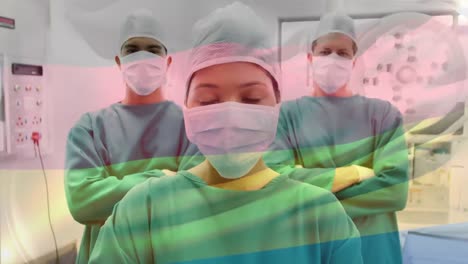 Animation-of-flag-of-germany-waving-over-surgeons-in-operating-theatre