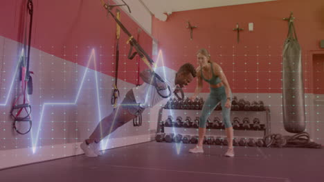 animation of data processing over diverse man and woman exercising in gym