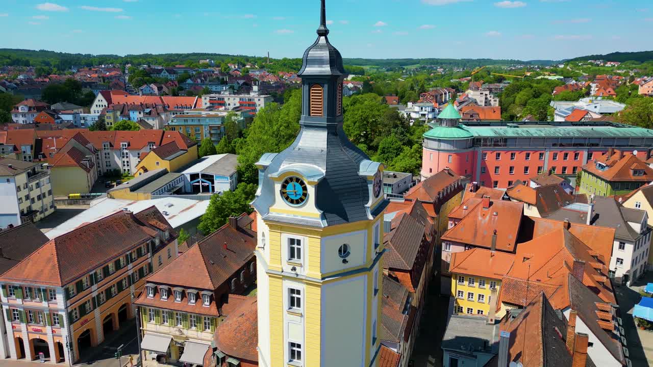 4K Aerial Drone Video of the Historic Herrieder Clock Tower in the Old Town area of Downtown Ansbach, Germany