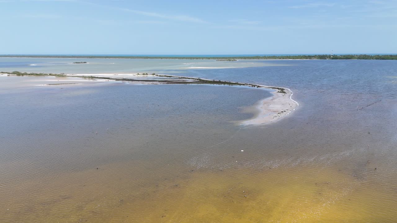 Aerial view of the Río Lagartos lagoon in Yucatán, Mexico. Sandbanks, shallow turquoise waters, and mangroves create a pristine coastal landscape