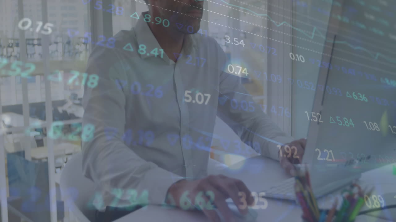 Animation of financial data processing over caucasian businessman using computer in office