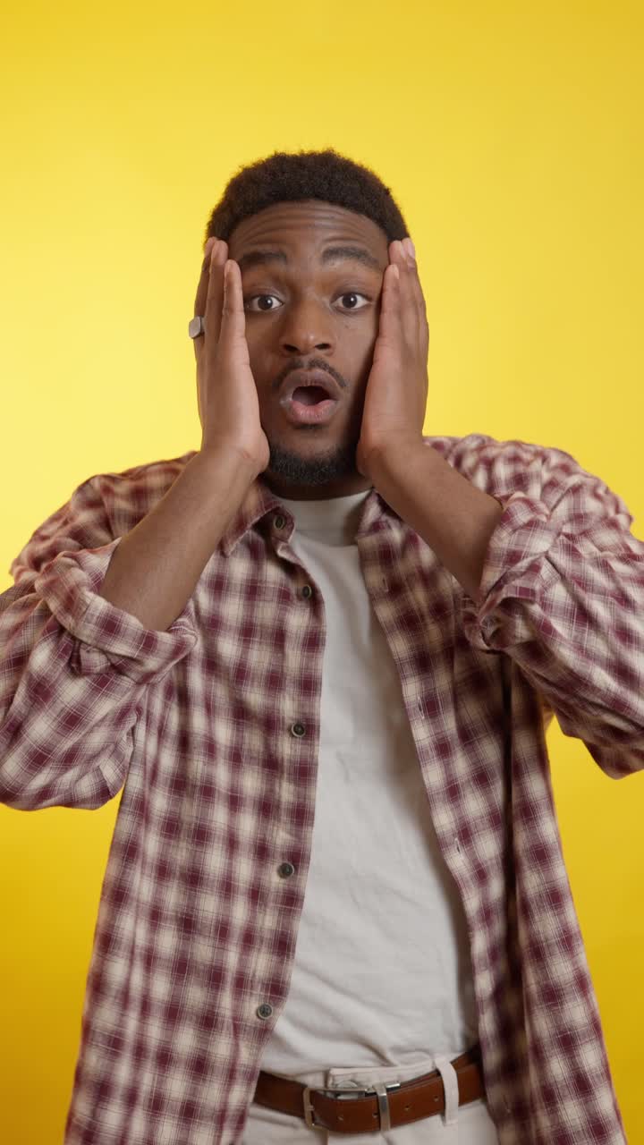 Shocked man in plaid shirt