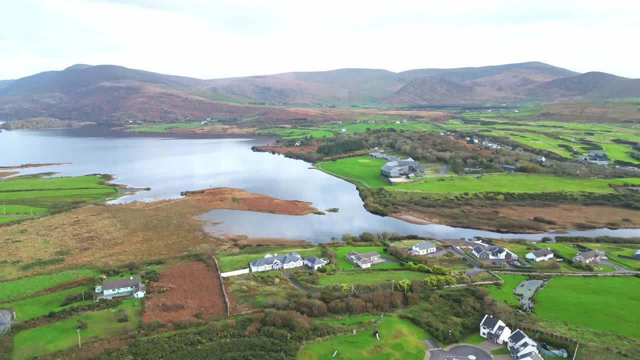 Aerial view of Waterville, Ireland with lush green landscape and water