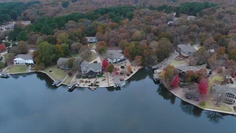 aerial reveal of executive homes along the shoreline