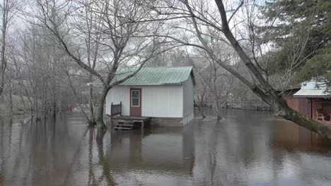 aerial shot of flooded homes, trailers, and streets in quebec neighborhood.