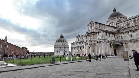 peoples visiting pisa cemetery, italy