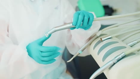 dentist preparing dental equipment