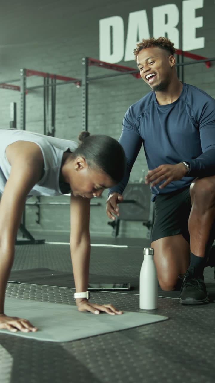 Happy Personal Trainer High-Fives Woman After Gym Workout