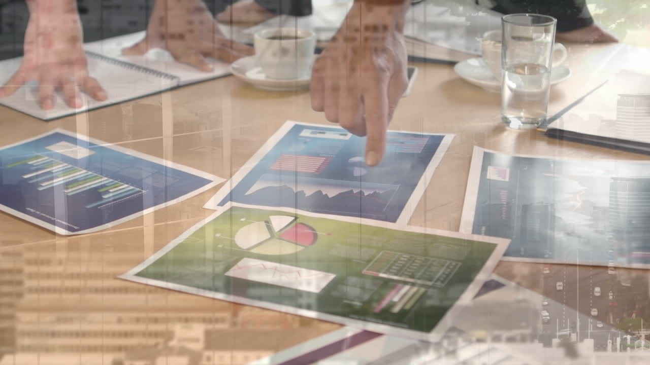 Animation of cityscape over diverse business people in office