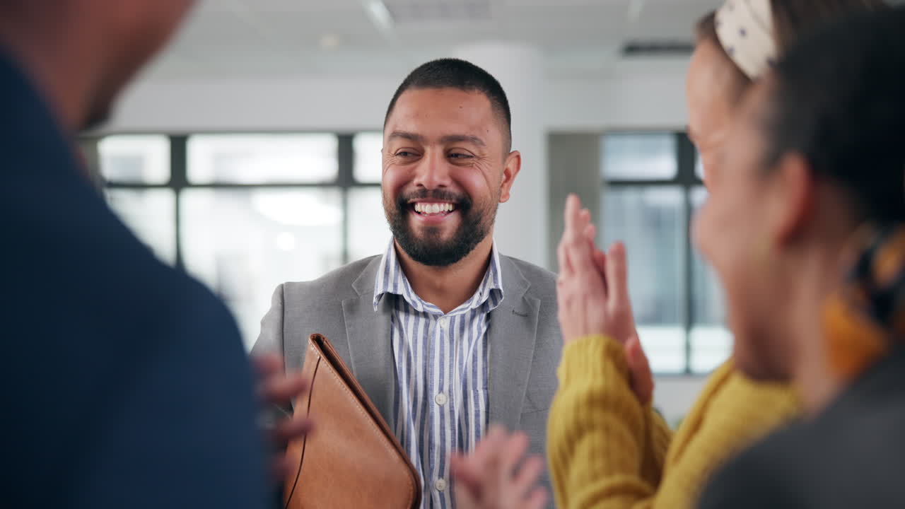 Business professionals celebrating success in an office setting