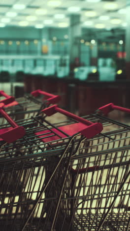 stacked shopping carts in a supermarket