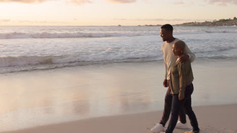 Beach,-couple-and-sunset-walking-on-the-beach