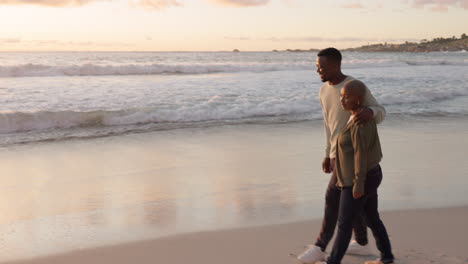 beach, couple and sunset walking on the beach