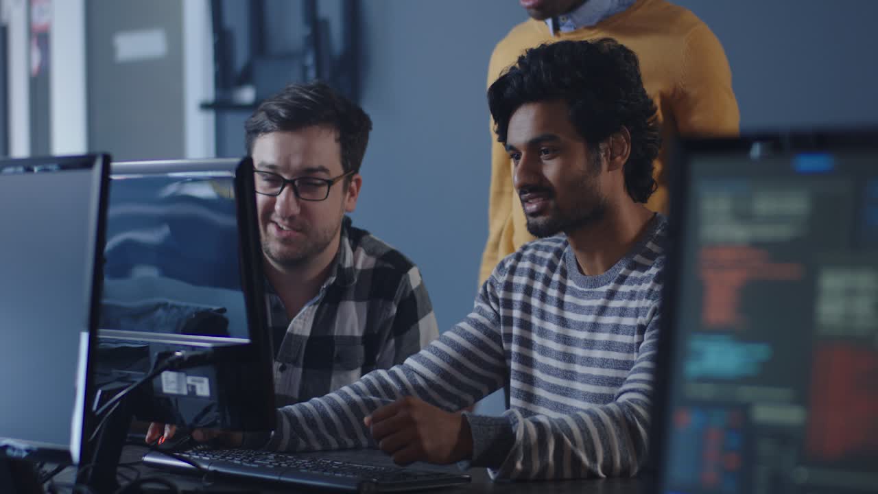 Diverse Team Working Together on Computers