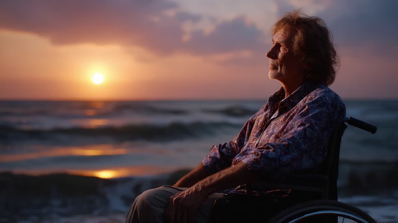 Contemplative Moment at Sunset: A Senior Man in a Wheelchair Gazes over the Ocean Waves as the Sun Sets on the Horizon, Embracing Nature's Tranquility
