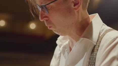 musician playing piano energetically