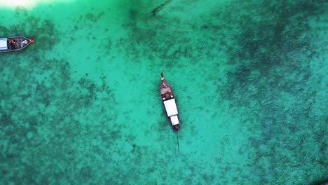 Girl-lies-on-longtail-boat-in-bay-thailand