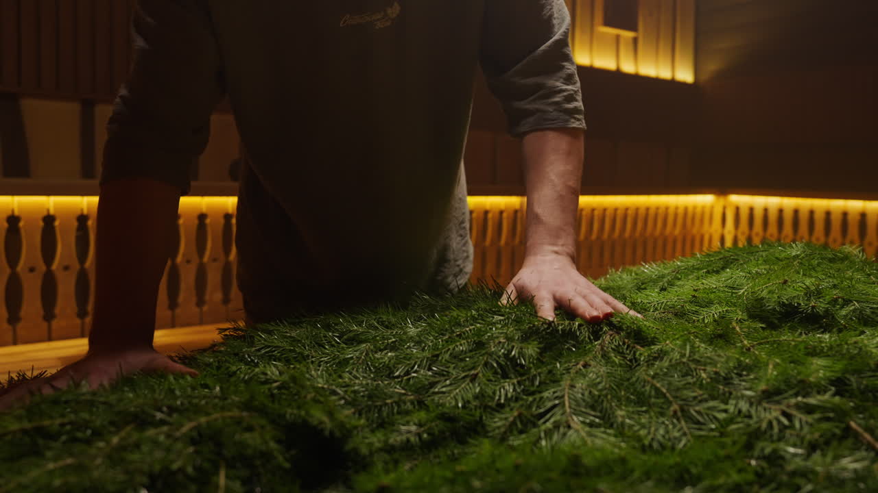 Person preparing a Christmas tree