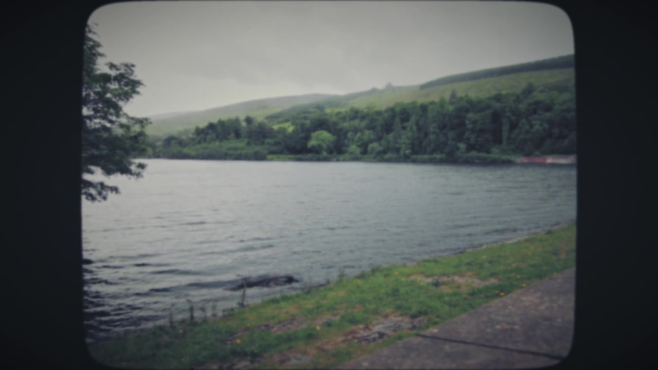 A view of a lake surrounded by hills