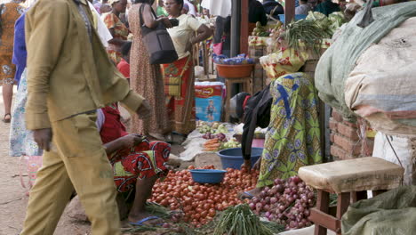 women sorting vegetables at market in kigali, rwanda.