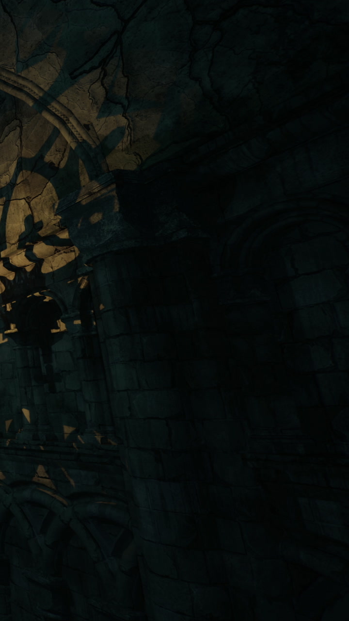 Old stone structure with detailed carvings in a shadowed area during night time