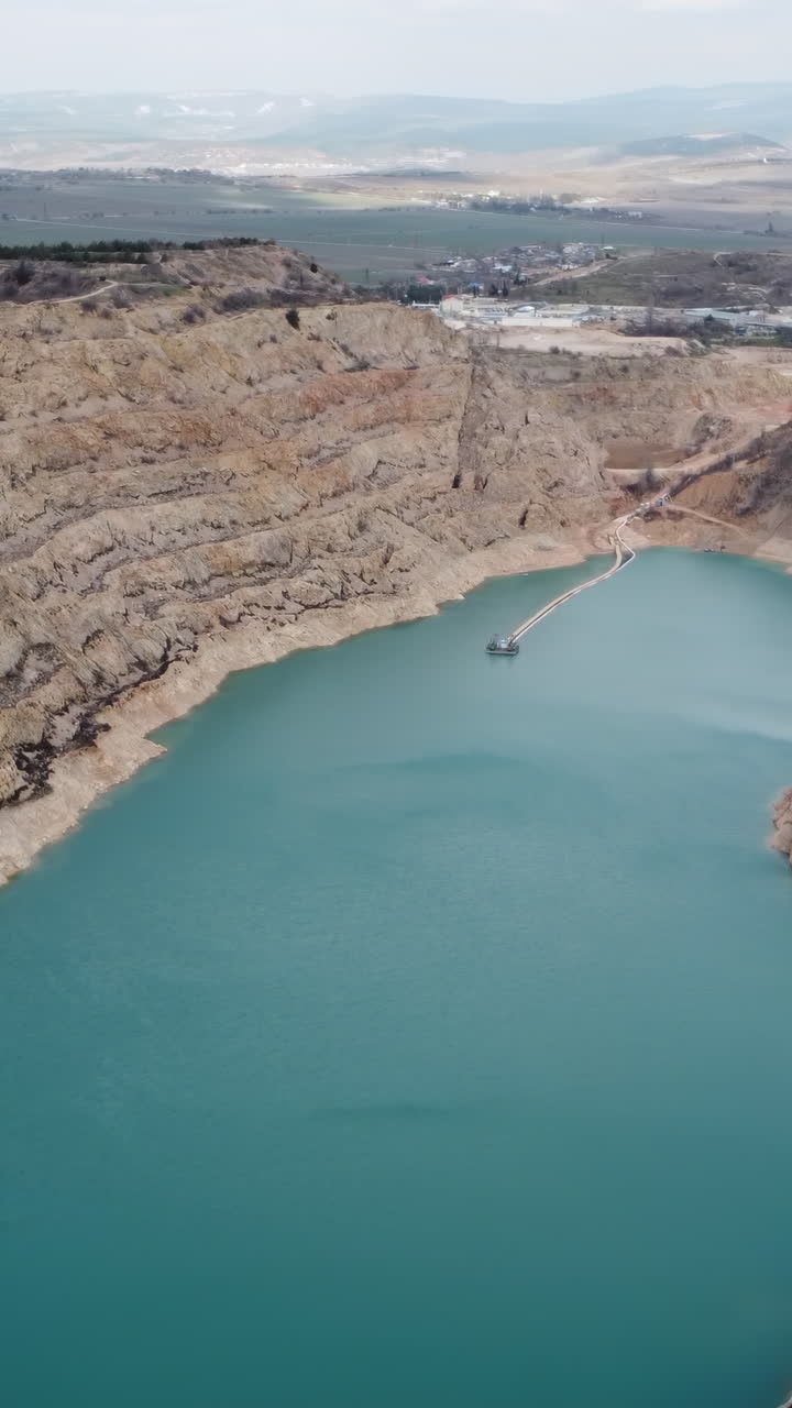 Quarry Lake with Mining Equipment