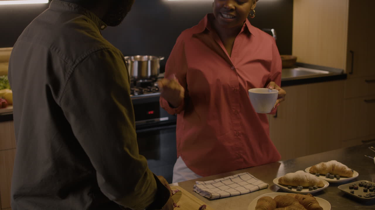 Couple talking in the kitchen