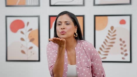 Modern-Indian-woman-giving-flying-kisses