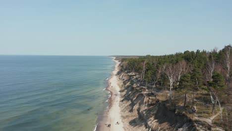 aerial: flying above the dutchman's cap beach in klaipeda on a sunny day