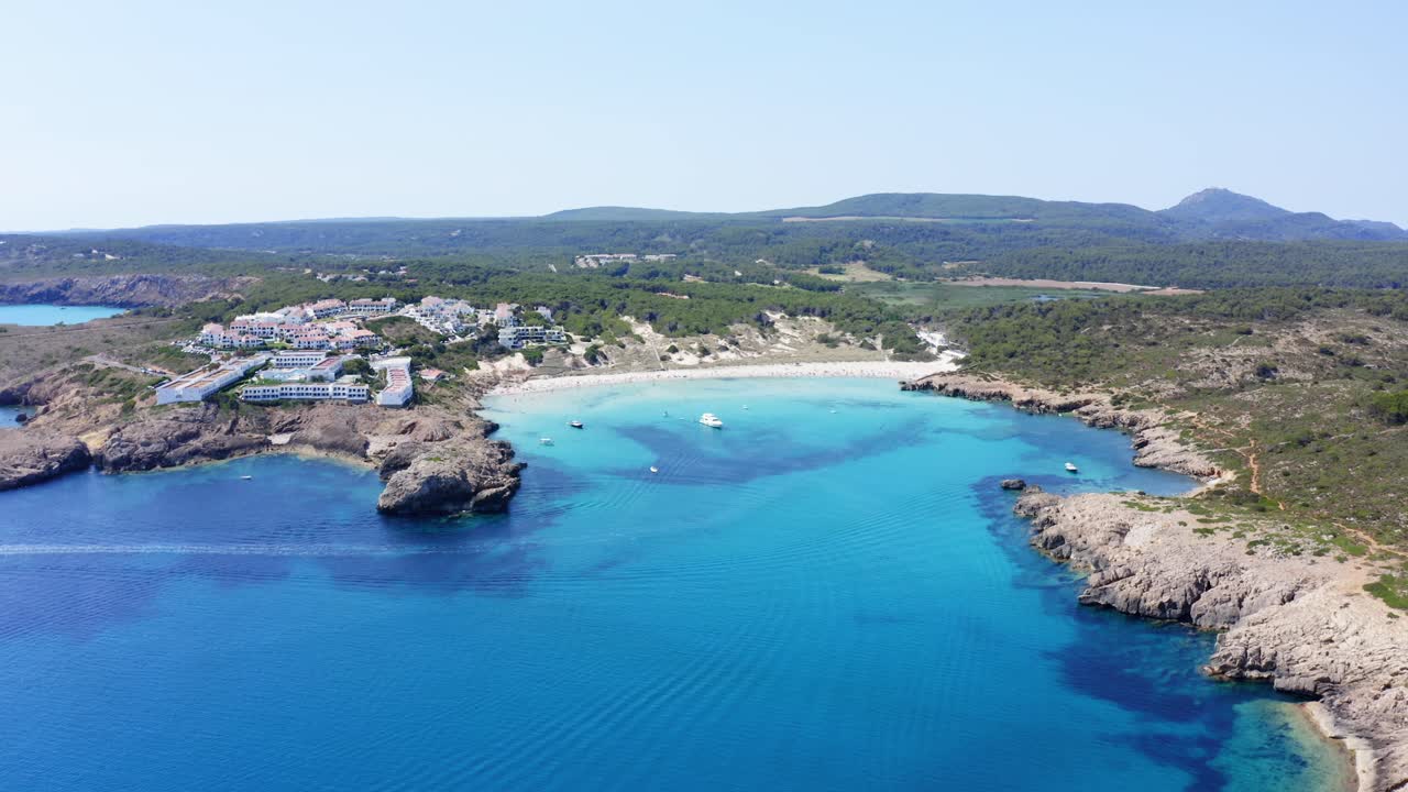 Luxury accomodation in Menorca Spain with boats anchored close to shore
