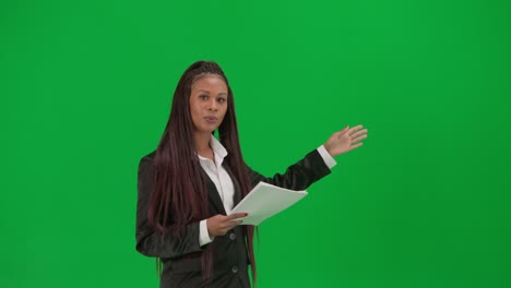 businesswoman presenting documents on green screen